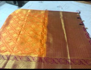 Orange Silk Saree with Golden Border