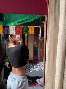 black crop to with long flared sleeves