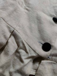 Cream Peplum Blouse with Black Buttons
