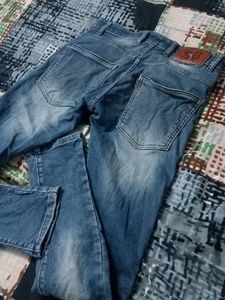 Distressed Blue Denim Jeans