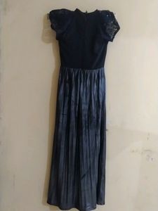Party Wear Gown Of' S' Size Available.... Basically It's Neck Is Halter Neck ....If Any One Don't Want Sleeves Can Remove It ...On Removal It Looks Like Halter Neck ....