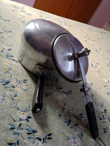 A silver pressure cooker