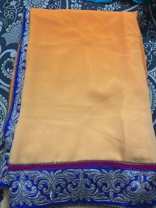 Vibrant Orange Saree with Silver Embroidery