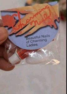 colorful safety pins and false nails