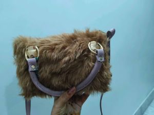 brown fur sling bag