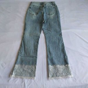 Light Wash Flared Jeans with Lace Trim