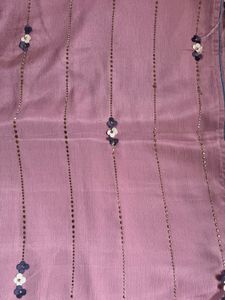 Elegant Pink Saree with Floral Embellishments