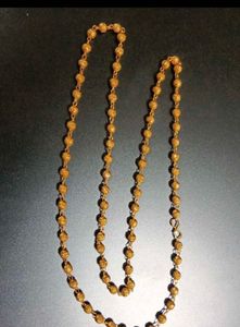 Elegant Gold Beaded Necklace with Swastik