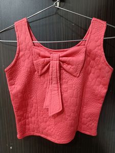 Top With Cute Tie Design At The Back And Front And With The Pink Colour At Size S
