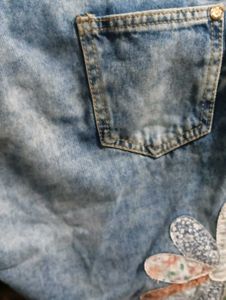 Distressed Denim Jeans with Floral Appliques