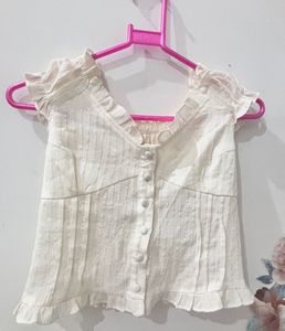 Cream Sleeveless Ruffle Button Crop Top2. Beige Hi