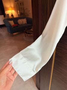 Elegant White Ruffled Satin Shirt