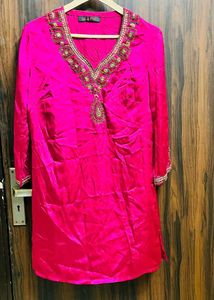 Elegant Pink Kurti with Intricate Gold Embroidery