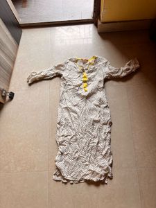 Elegant Cream Kurta with Yellow Tassels