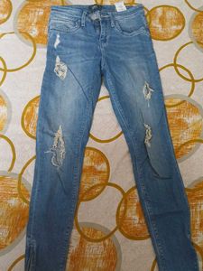 Distressed Blue Denim Jeans