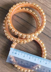 Elegant Pearl & Gold Bangles