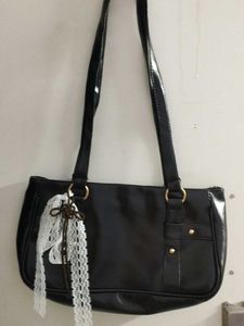 Chic Black Shoulder Bag with Lace Accent