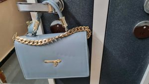 Stylish Light Blue Handbag with Gold Chain
