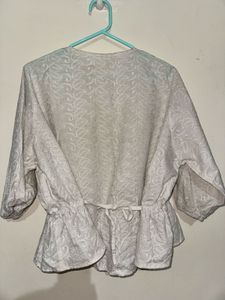 Elegant White Embroidered Peplum Top