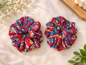 red coloured floral scrunchies
