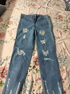 Distressed Blue Denim Jeans
