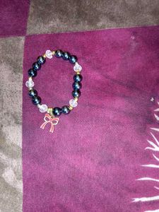 Charming Beaded Bracelet with Bow Charm