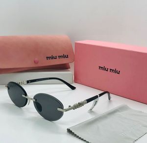 Miu-Miu Oval Sunglasses
