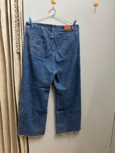 Ripped Wide Leg Denim Jeans
