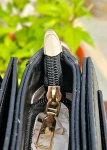 Chic Black Handbag with Embellished Detail