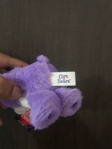 purple Care Bears plush toy keychain featuring