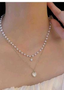 Layered Pearl Necklace with Heart Pendant