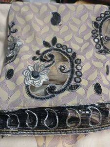 used Elegant net Sequined Saree.without blouse