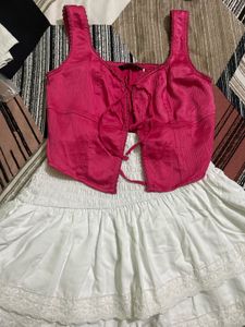 Chic Pink Lace-Up Crop Top with white skirt