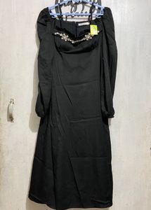 Elegant Black Dress with Embellished Neckline