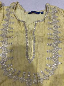 Elegant Yellow Kurta with Intricate Embellishments