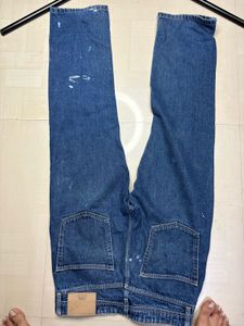 Stylish Blue Jeans with Paint Splatter Detail