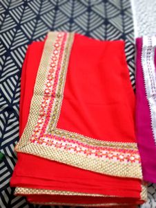 Vibrant orange Saree with Embellished Border