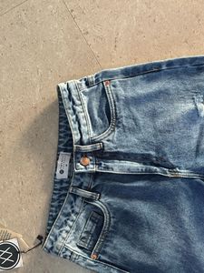 Distressed Blue Denim Jeans