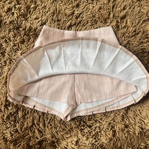 high-waisted pleated mini skirt