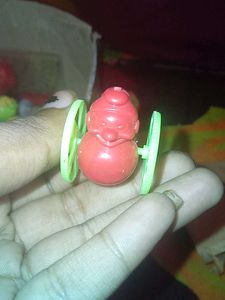 Vintage Toy Character with Wheels