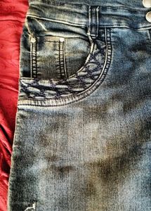 Distressed Blue Denim Jeans