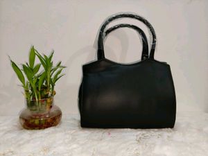 Chic Black Handbag with Silver Accent