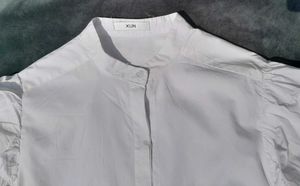 White balloon-sleeve shirt.