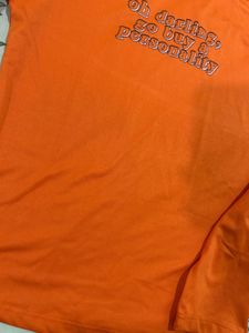 Orange Turtleneck Graphic Top
