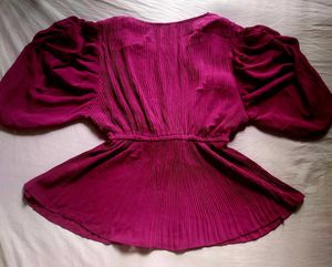 A beautiful decent purple top with florry sleeves