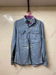 A MILDLY BLUE FADED DENIM SHIRT