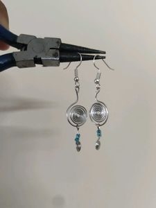Silver Swirl Earrings with Blue Beads