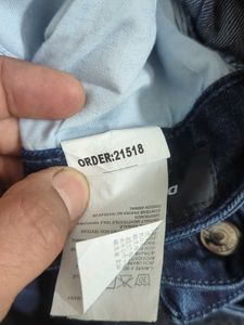 Stylish Dark Wash Jeans with Unique Embellishments
