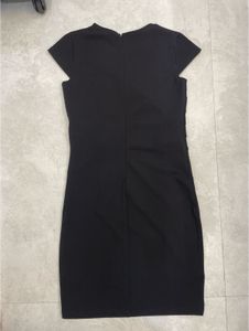 Chic Black Dress with Gold Accent