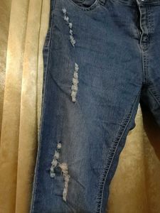 Distressed Blue Denim Jeans